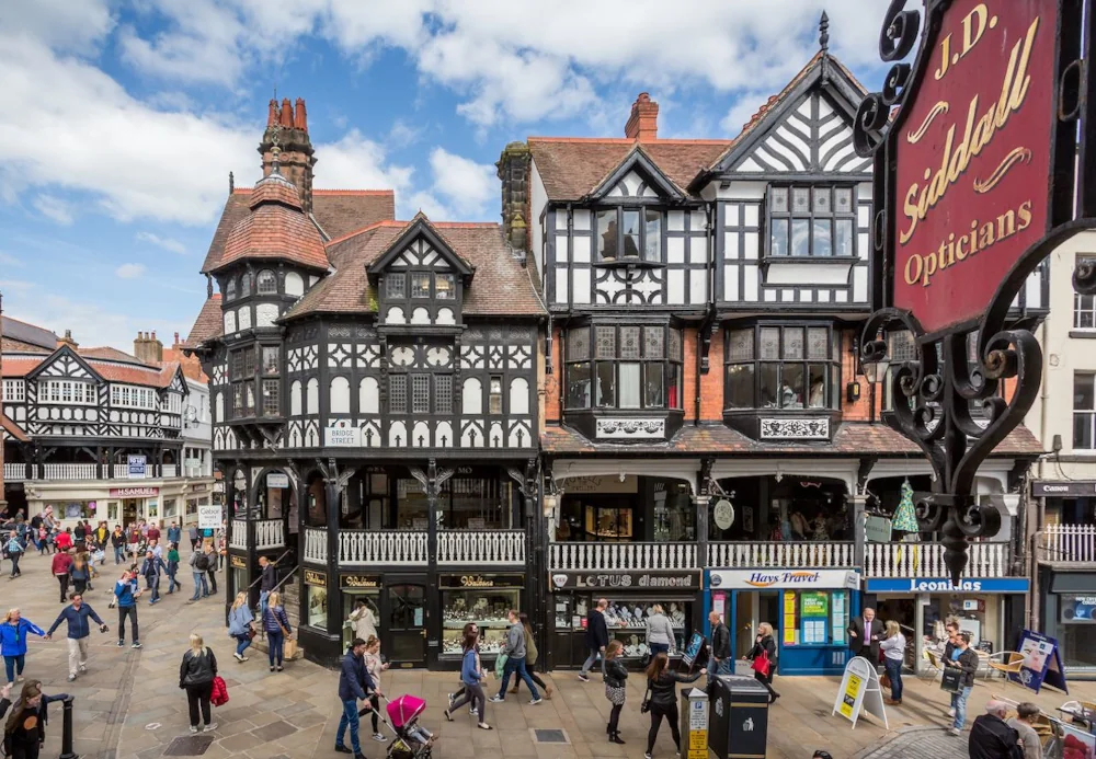 Tudor buildings and pedestrians in Chester.